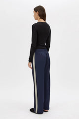 Locus Scuba Pant in Midnight by Camilla and Marc, a mid-rise scuba pant with side stripe detailing, pintuck legs, and zip hem finish.