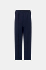 Locus Scuba Pant in Midnight by Camilla and Marc, a mid-rise scuba pant with side stripe detailing, pintuck legs, and zip hem finish.