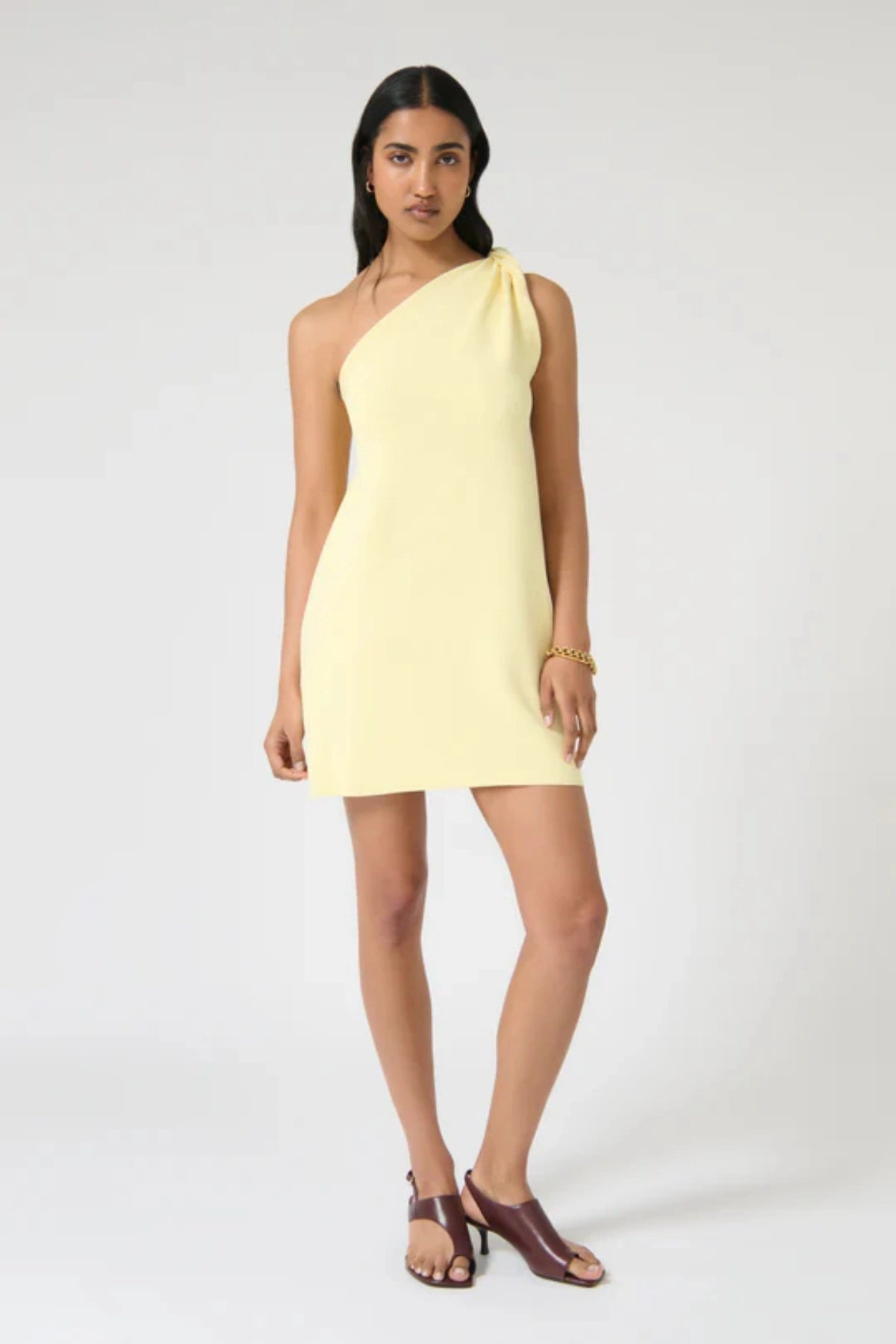 Loreta Twist Dress – Butter by Onte, a crepe knit mini with one-shoulder twist. Perfect for elevated summer dressing or nights out.