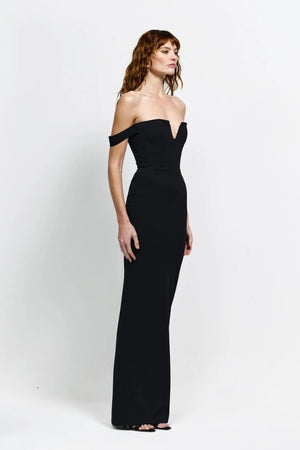 Louella Gown in Black by Effie Kats, an off-shoulder floor-length gown with deep V front, cinched waist, and back split for elegant eveningwear.