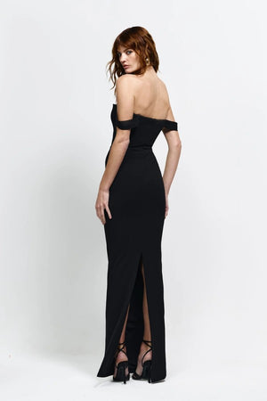 Louella Gown in Black by Effie Kats, an off-shoulder floor-length gown with deep V front, cinched waist, and back split for elegant eveningwear.