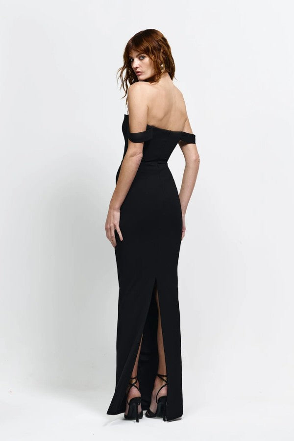 Louella Gown in Black by Effie Kats, an off-shoulder floor-length gown with deep V front, cinched waist, and back split for elegant eveningwear.