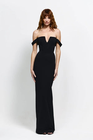 Louella Gown in Black by Effie Kats, an off-shoulder floor-length gown with deep V front, cinched waist, and back split for elegant eveningwear.