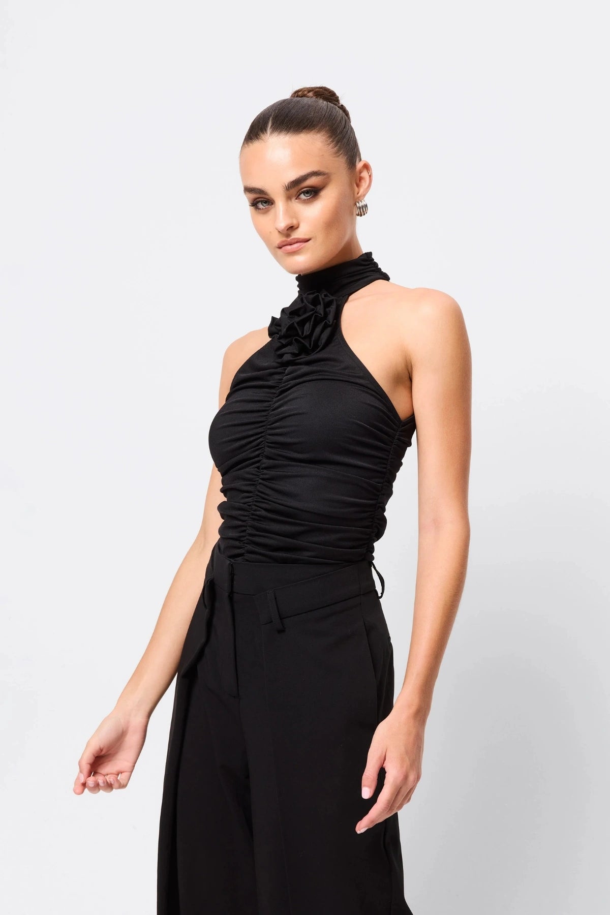 Love Again Top Black by Mossman, halter Lycra top with racerback, gathered detail and rosette accent, a trendy piece perfect for chic evenings or events.