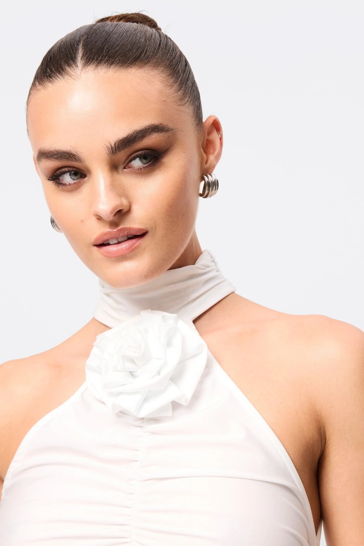 Love Again Top White by Mossman, halter Lycra top with racerback, gathered detail and rosette accent, a trendy piece perfect for chic evenings or events.