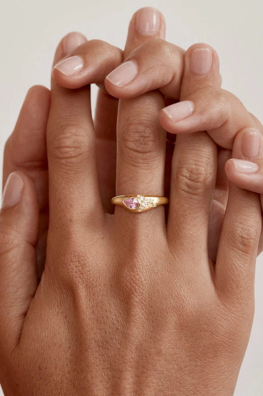 Love Without Limits Ring by By Charlotte – 18k gold vermeil ring with pear-cut pink gemstone and cubic zirconia.