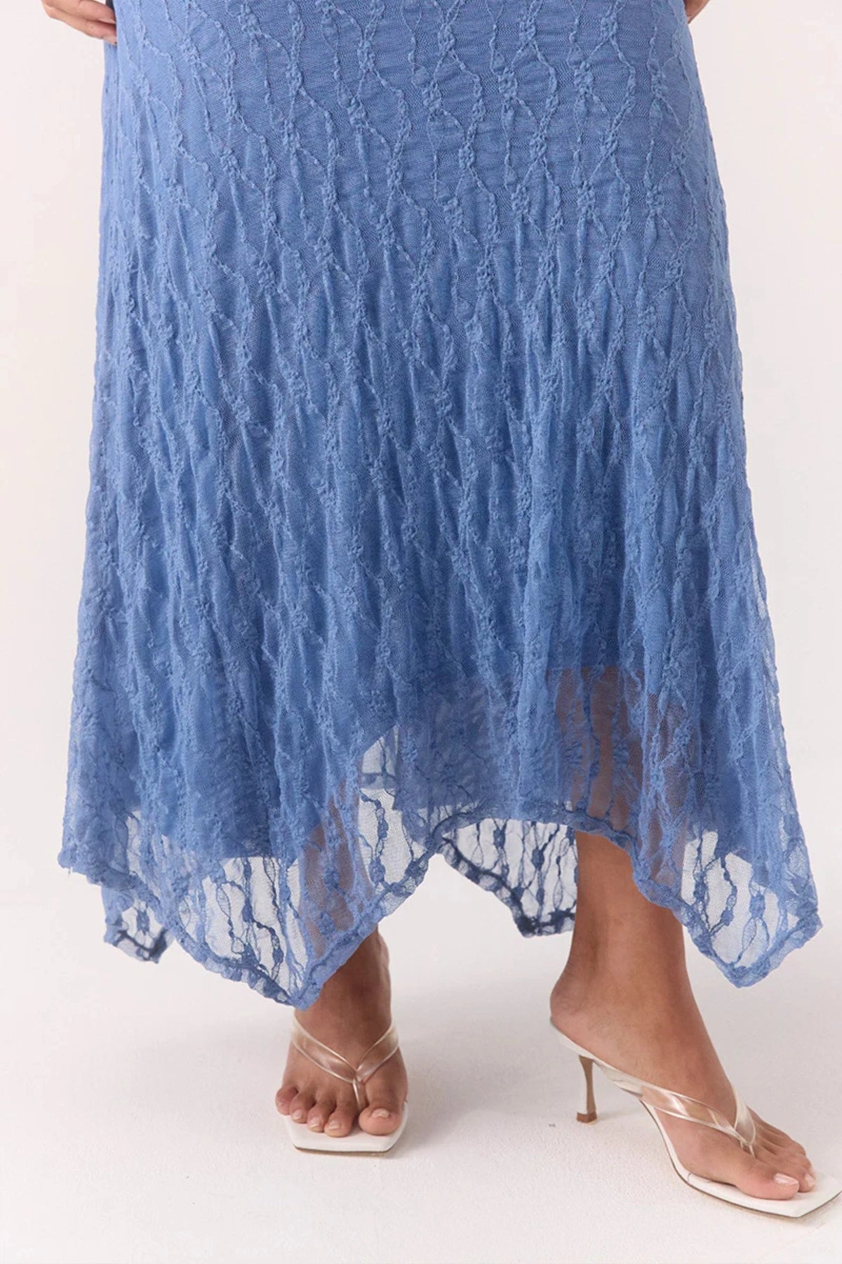 Lowri Skirt Slate Blue by Sovere, textured lace midi with asymmetric gathered waistband and handkerchief hem for soft, structured movement and effortless edge.