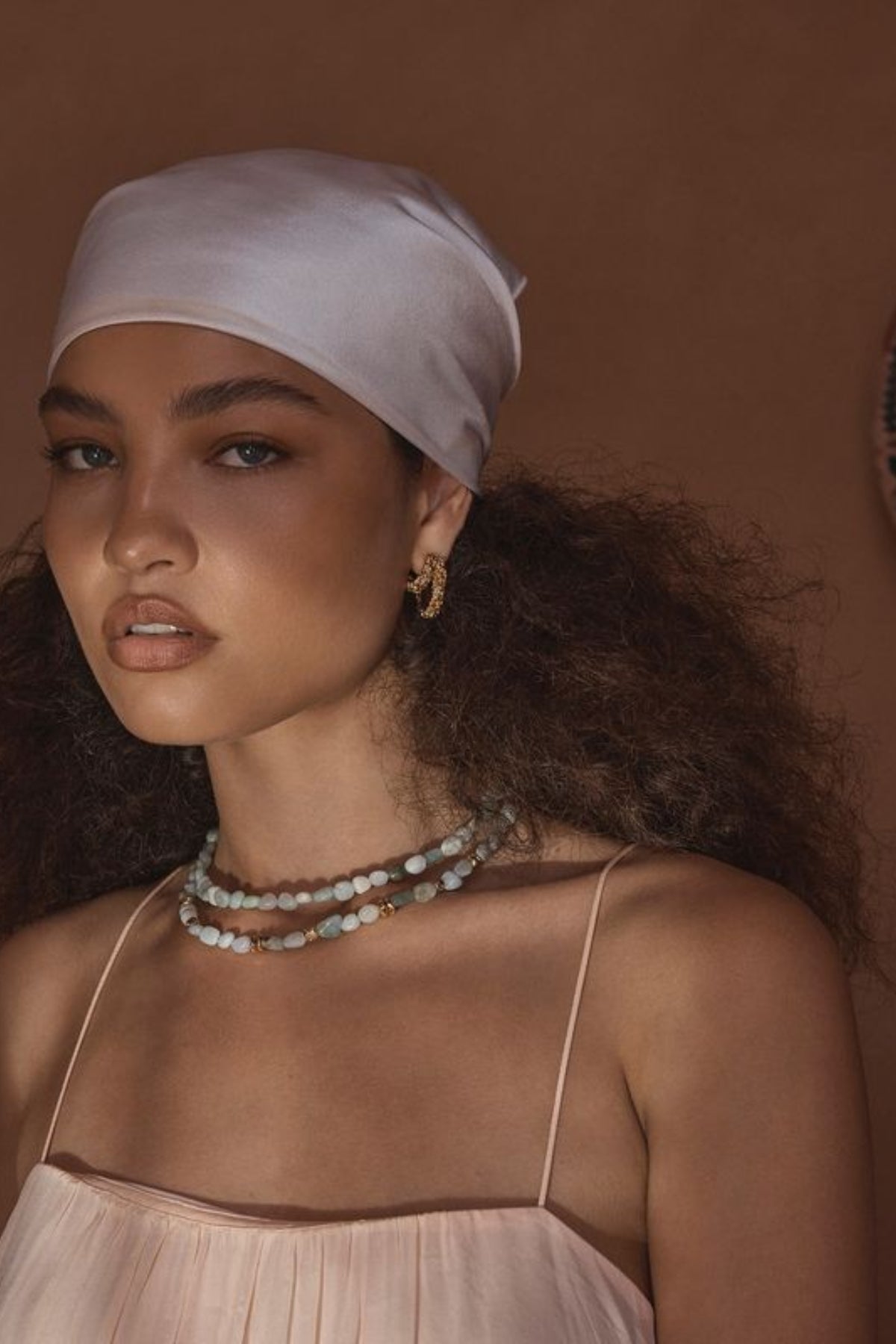 Lucca Earrings by Amber Sceats – handcrafted in Italy with 24K gold-plated brass, featuring a curved silhouette for timeless elegance.
