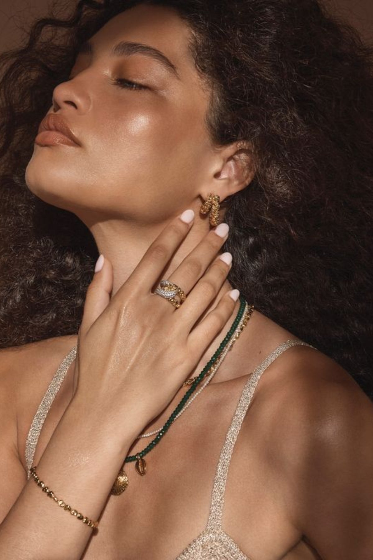 Lucca Earrings by Amber Sceats – handcrafted in Italy with 24K gold-plated brass, featuring a curved silhouette for timeless elegance.
