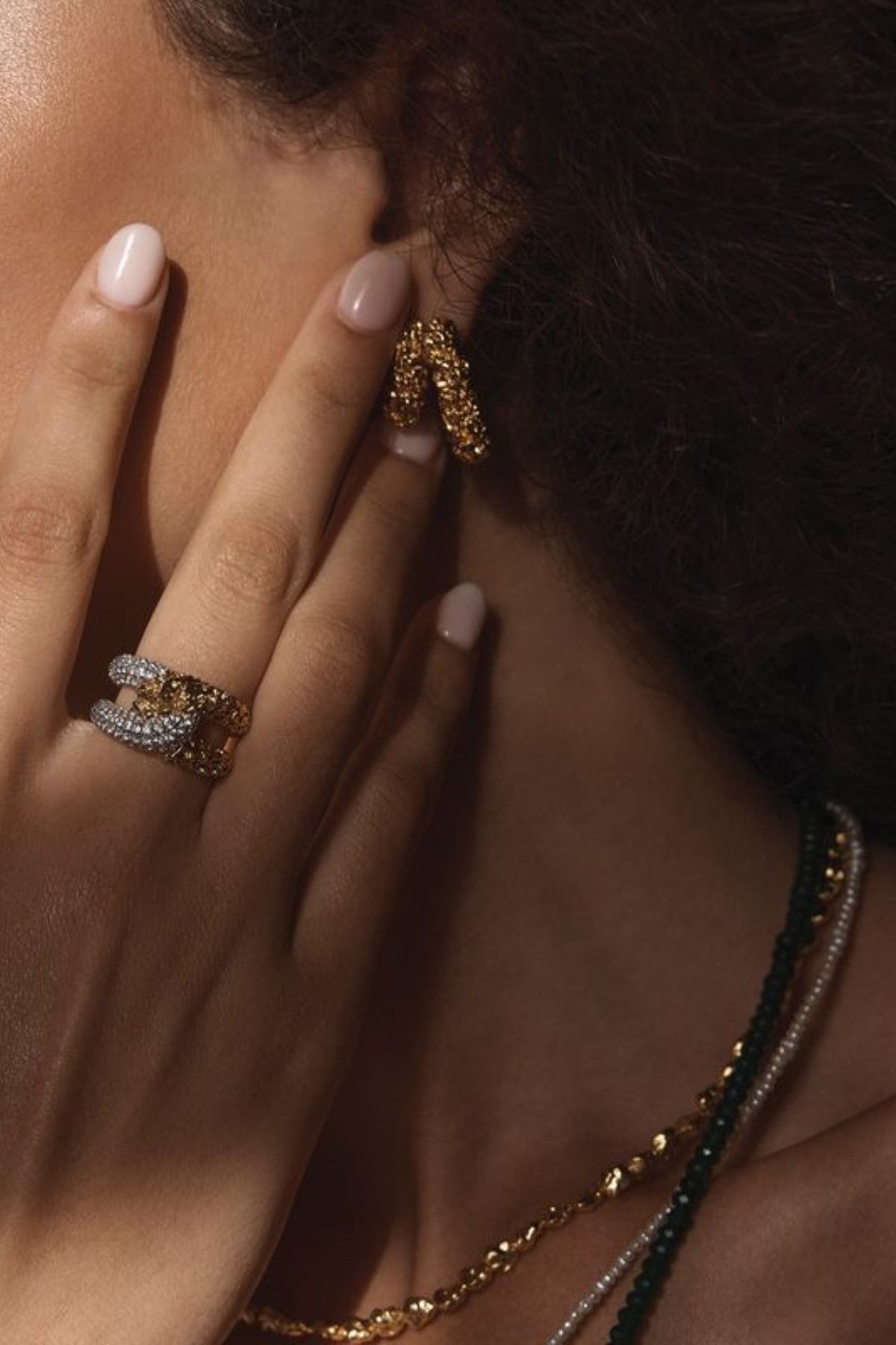 Lucca Earrings by Amber Sceats – handcrafted in Italy with 24K gold-plated brass, featuring a curved silhouette for timeless elegance.
