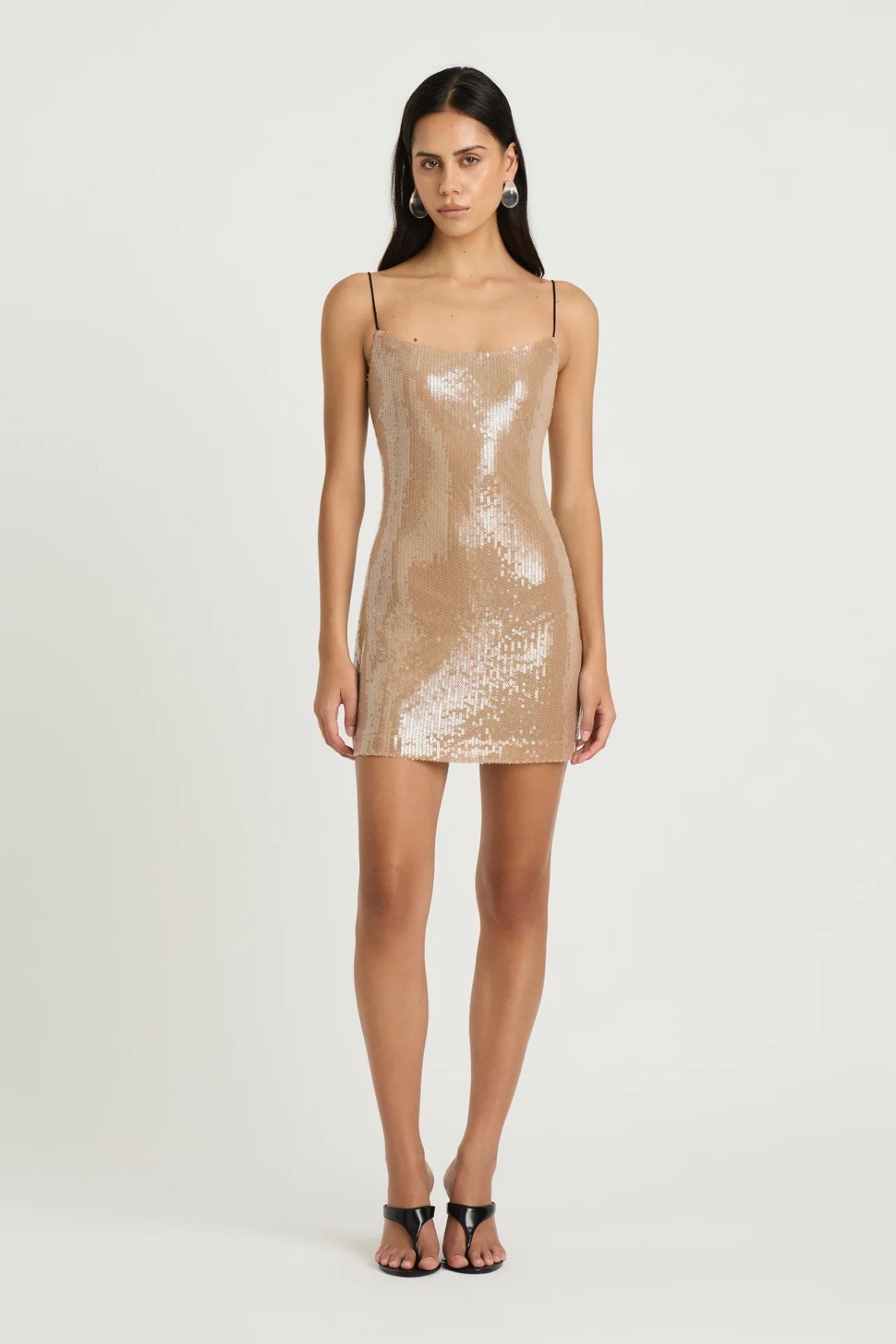 Lucca Mini Dress by Benni, a shimmering sequin mini with contrast black straps. Perfect for nights out, parties, or festive occasions.