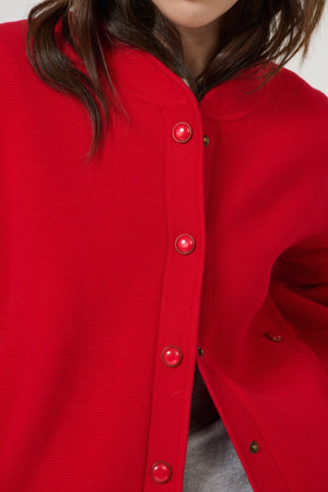 Lucia Bomber Red by Onte - red knit bomber jacket with snap buttons and rib trim, designed for a structured modern look.