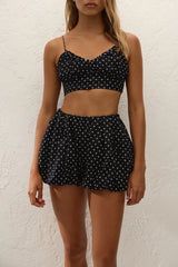 Lucia Top Lola Polka Dot Black Cream by Faithfull the Brand – a cropped top with polka dot print. Perfect for summer styling.