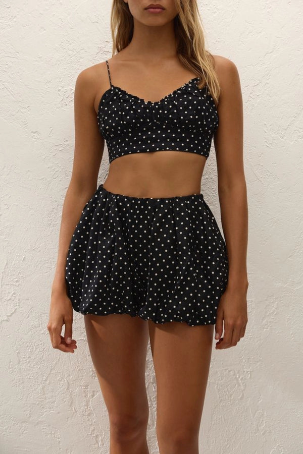 Lucia Top Lola Polka Dot Black Cream by Faithfull the Brand – a cropped top with polka dot print. Perfect for summer styling.