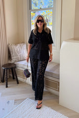 Lucy Lace Elastic Pant in Black by Sneaky Link, sheer floral lace wide-leg trousers with an easy pull-on fit. Perfect for set styling or standalone looks.
