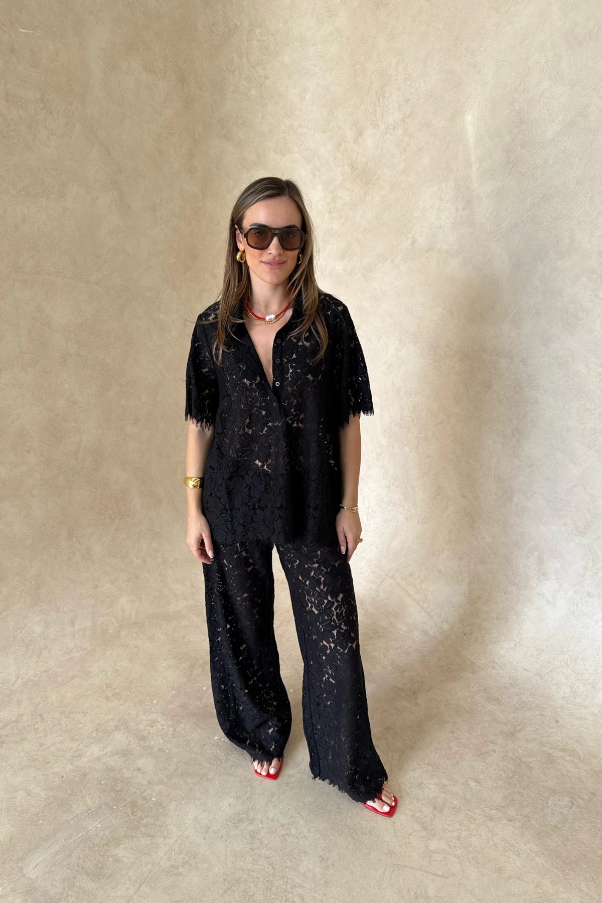 Lucy Lace Elastic Pant in Black by Sneaky Link, sheer floral lace wide-leg trousers with an easy pull-on fit. Perfect for set styling or standalone looks.
