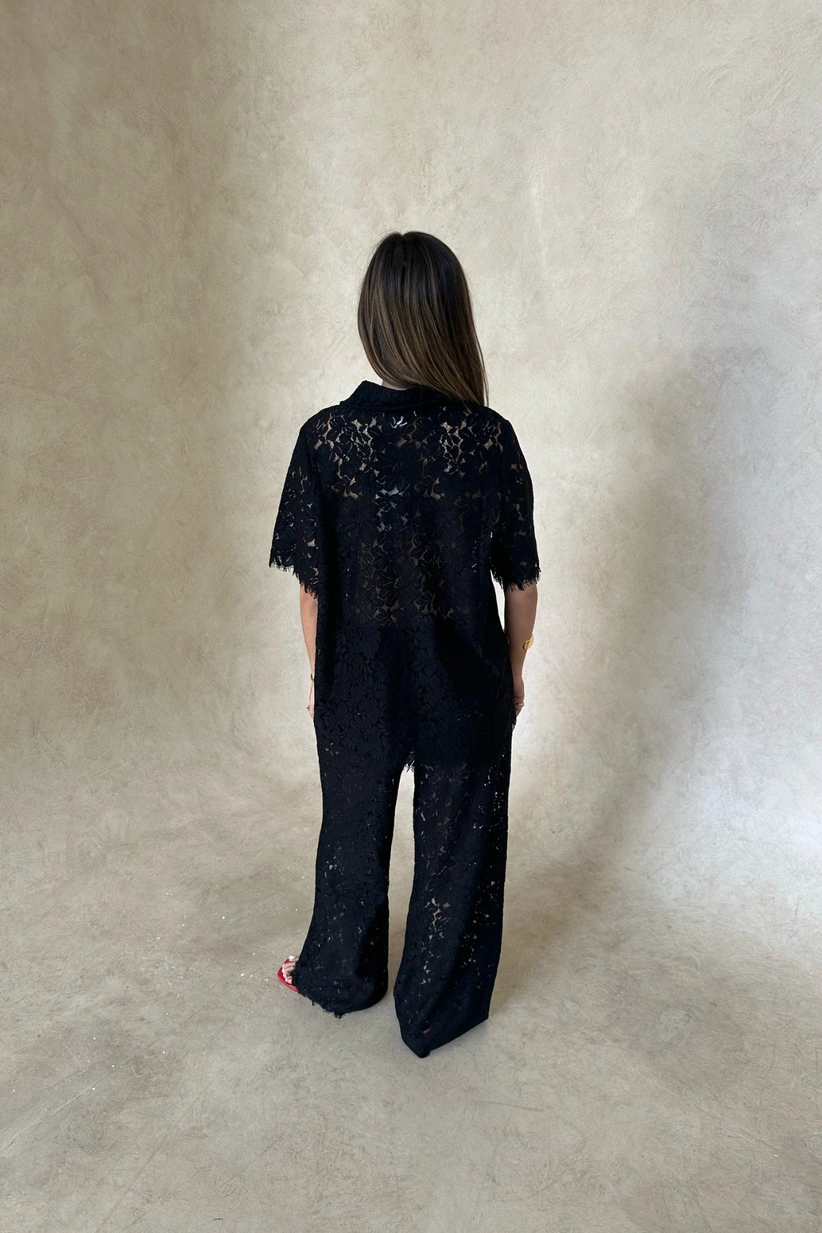 Lucy Lace Elastic Pant in Black by Sneaky Link, sheer floral lace wide-leg trousers with an easy pull-on fit. Perfect for set styling or standalone looks.
