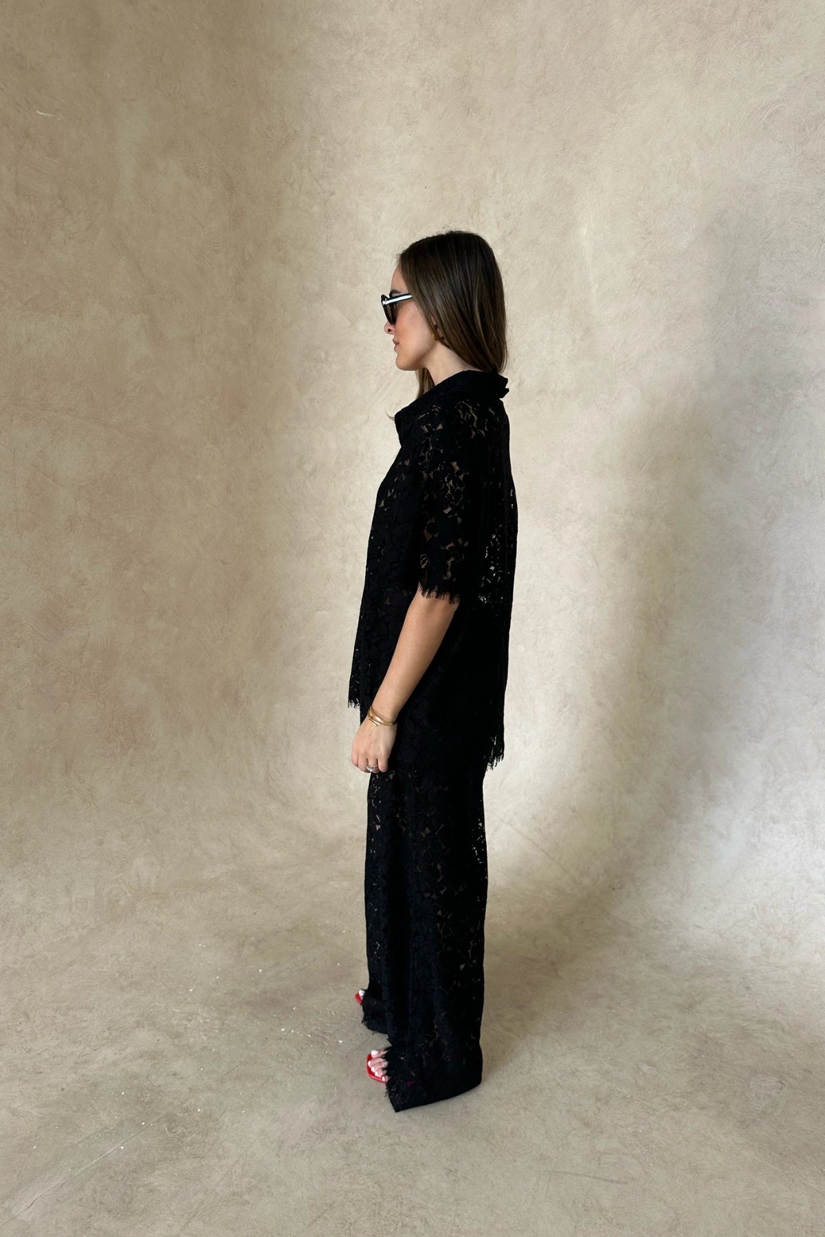 Lucy Lace Elastic Pant in Black by Sneaky Link, sheer floral lace wide-leg trousers with an easy pull-on fit. Perfect for set styling or standalone looks.
