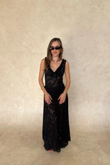 Lucy Lace Maxi Dress in Black by Sneaky Link, a sheer lace gown with draped neckline and elegant silhouette. Perfect for evening occasions.
