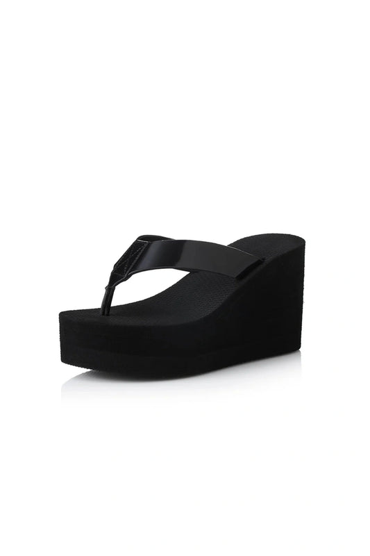 Lulu Sandal by Alias Mae, a bold black leather wedge with 9cm lift and clean silhouette. Perfect for elevated everyday or evening wear.