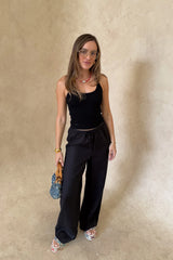 Luna Linen Pant in Black by Sneaky Link – a breathable linen pant with elastic waist and relaxed fit. Perfect for effortless summer styling.
