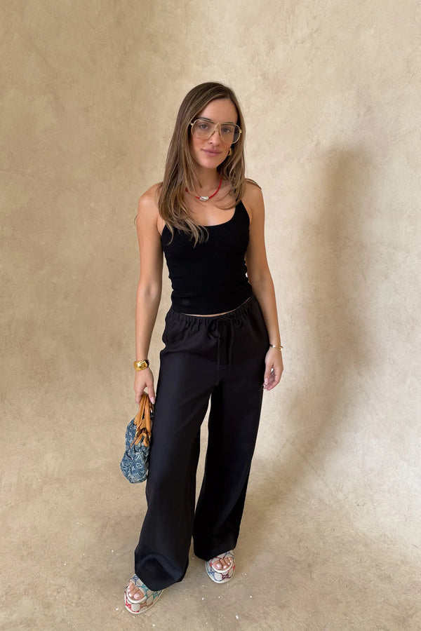 Luna Linen Pant in Black by Sneaky Link – a breathable linen pant with elastic waist and relaxed fit. Perfect for effortless summer styling.