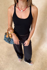 Luna Linen Pant in Black by Sneaky Link – a breathable linen pant with elastic waist and relaxed fit. Perfect for effortless summer styling.