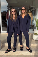 Lyndon Knit Pant Navy by Camilla and Marc, soft knit pant with slim leg, ribbed waistband with drawcords, and signature pin stitch detailing for a polished fit.