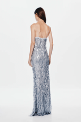 The 'Sapphire' Maxi Dress Dove Grey by MISHA, sequin maxi with plunging V-neckline, bust cutout, daring low back, body-con fit with volume at hem, dry clean only.