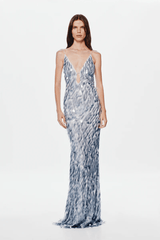 The 'Sapphire' Maxi Dress Dove Grey by MISHA, sequin maxi with plunging V-neckline, bust cutout, daring low back, body-con fit with volume at hem, dry clean only.