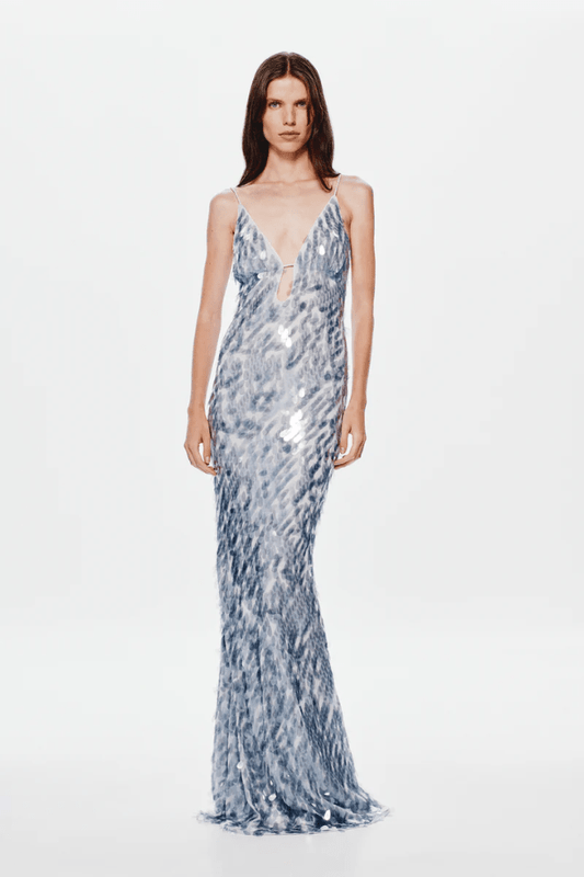 The 'Sapphire' Maxi Dress Dove Grey by MISHA, sequin maxi with plunging V-neckline, bust cutout, daring low back, body-con fit with volume at hem, dry clean only.