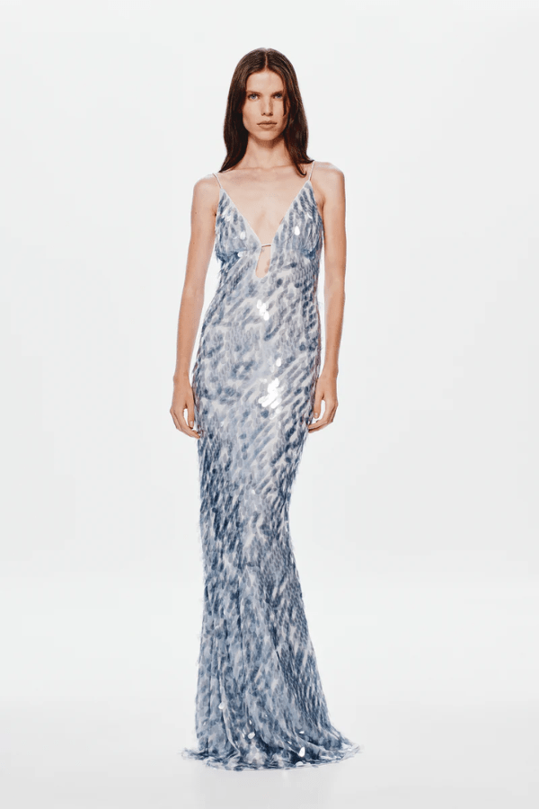 The 'Sapphire' Maxi Dress Dove Grey by MISHA, sequin maxi with plunging V-neckline, bust cutout, daring low back, body-con fit with volume at hem, dry clean only.