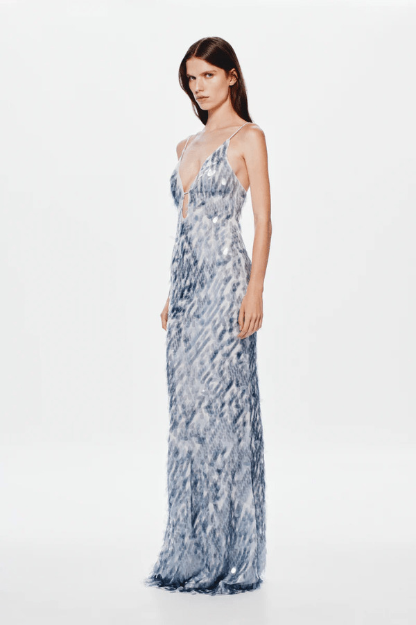 The 'Sapphire' Maxi Dress Dove Grey by MISHA, sequin maxi with plunging V-neckline, bust cutout, daring low back, body-con fit with volume at hem, dry clean only.