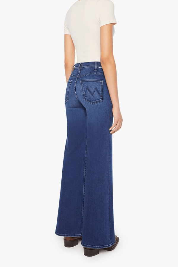 The Hustler Roller Sneak Homecoming High by MOTHER, high-rise wide-leg jeans in dark stretch denim with clean hem. Perfect for vintage-inspired looks.