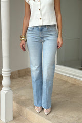 The Kick It Go Long by MOTHER, high-rise straight jeans in light blue semi-rigid denim with fading. Perfect for everyday vintage-inspired style.