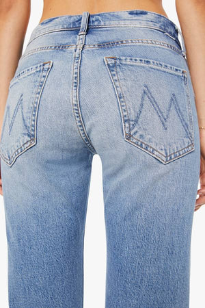 MOTHER The Mid Rise Hiker Hover in Fight For Your Right, a slim straight-leg jean with a mid-rise fit in a mid-blue wash with clean hem.