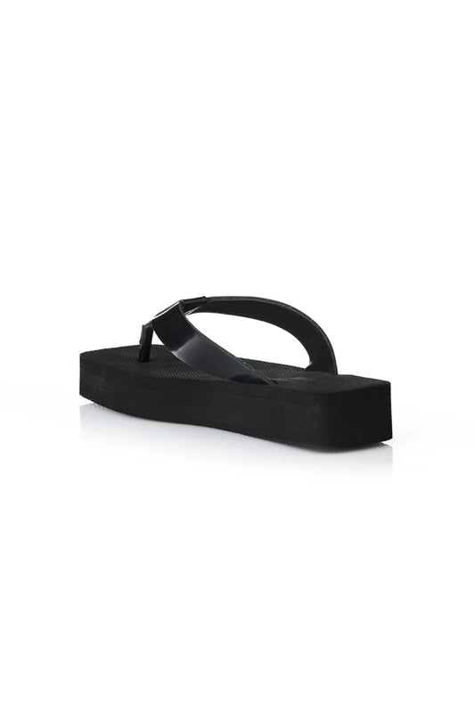 Maggie Sandal by Alias Mae, a black leather thong sandal with a 3.5cm platform sole. Perfect for modern casual styling all day.
