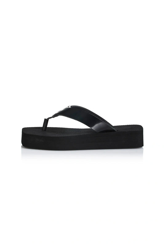 Maggie Sandal by Alias Mae, a black leather thong sandal with a 3.5cm platform sole. Perfect for modern casual styling all day.