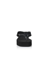 Maggie Sandal by Alias Mae, a black leather thong sandal with a 3.5cm platform sole. Perfect for modern casual styling all day.