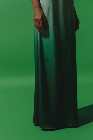 Magia Salvaje Dress Algae by Baobab – Trendy halter maxi with open back, front cutout, and delicate glass bead embellishments, perfect for elegant, breezy summer events.