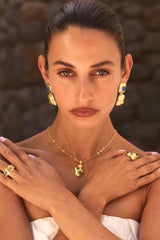 Maral Ring in Gold by Mountain & Moon, 18K gold plated double-band ring with aquamarine, peridot, and white CZ stones.