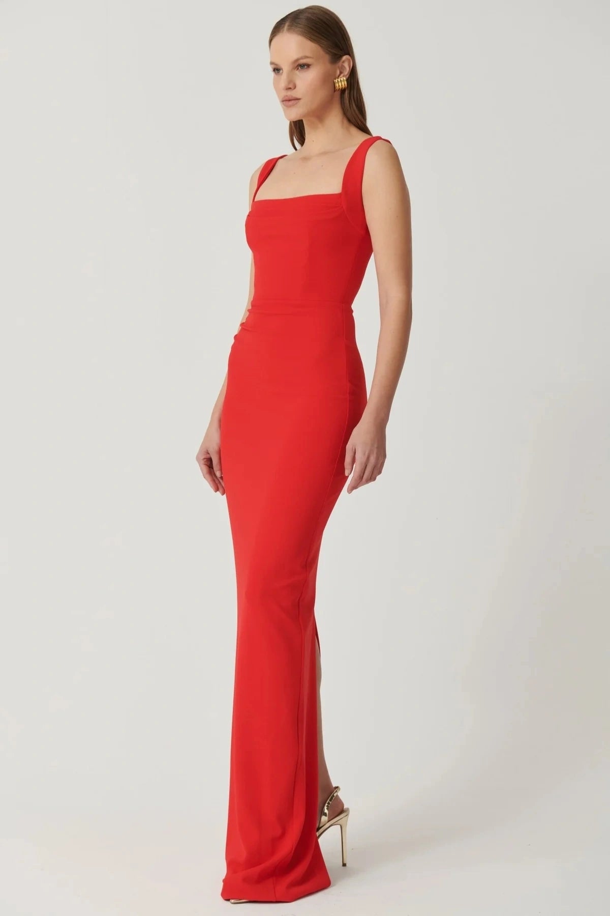 Marbella Gown Cherry Red by Effie Kats – A sleek crepe gown with bustier bodice, square neckline, and elegant draped detailing.