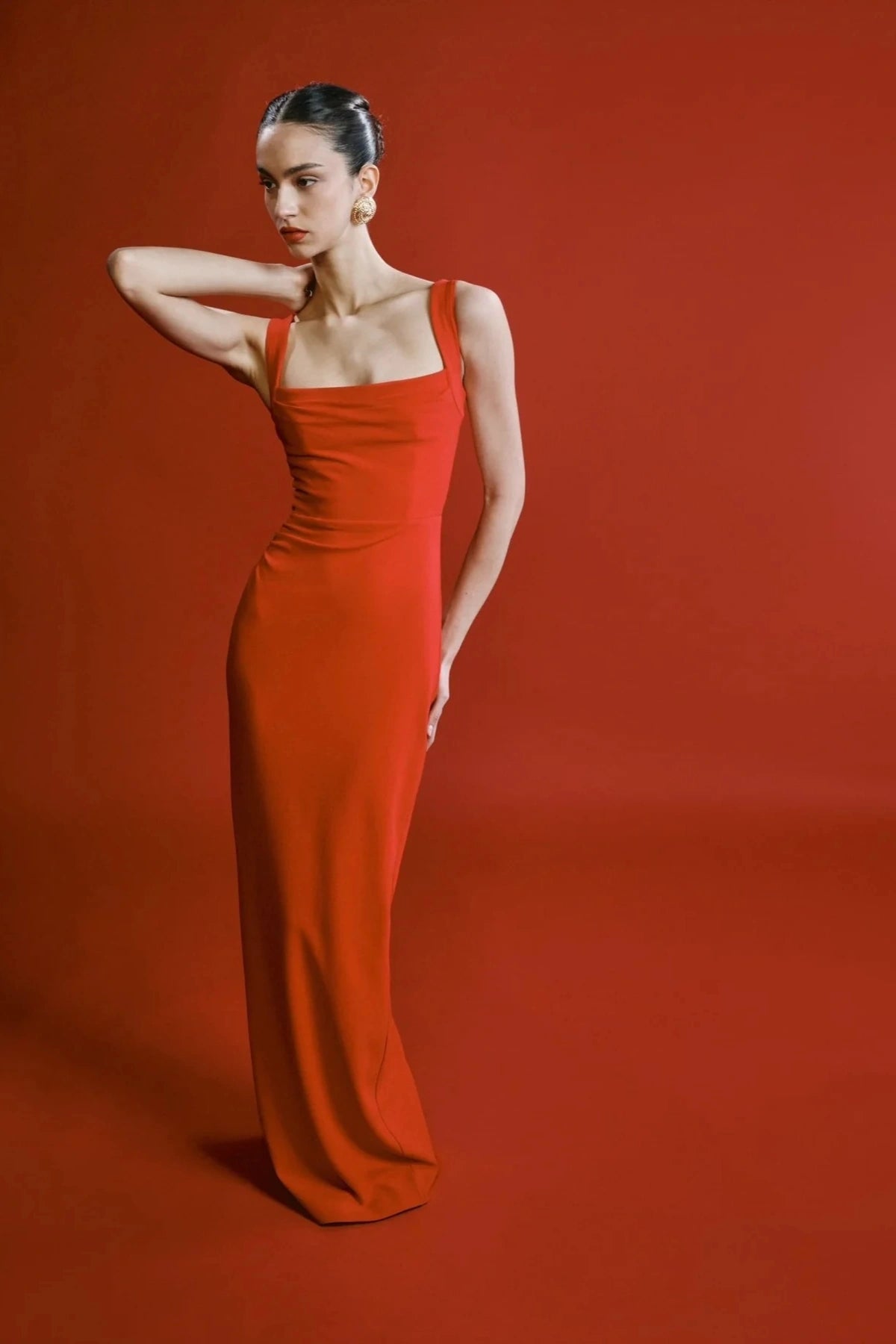 Marbella Gown Cherry Red by Effie Kats – A sleek crepe gown with bustier bodice, square neckline, and elegant draped detailing.
