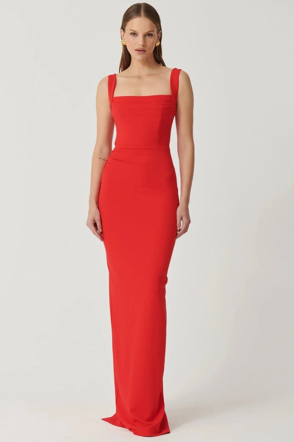 Marbella Gown Cherry Red by Effie Kats – A sleek crepe gown with bustier bodice, square neckline, and elegant draped detailing.