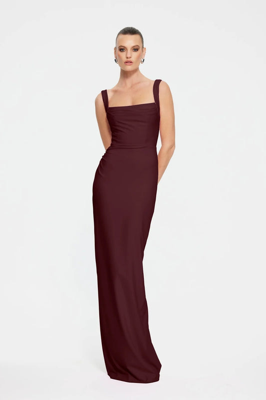 Marbella Gown in Wine by Effie Kats, a bustier-inspired floor-length gown with square neckline, ruched bodice, and figure-flattering stretch crepe.