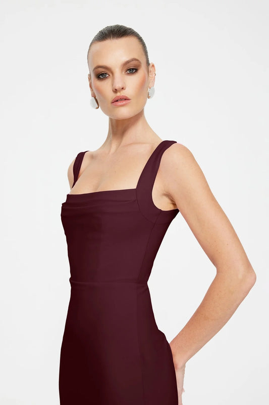 Marbella Gown in Wine by Effie Kats, a bustier-inspired floor-length gown with square neckline, ruched bodice, and figure-flattering stretch crepe.