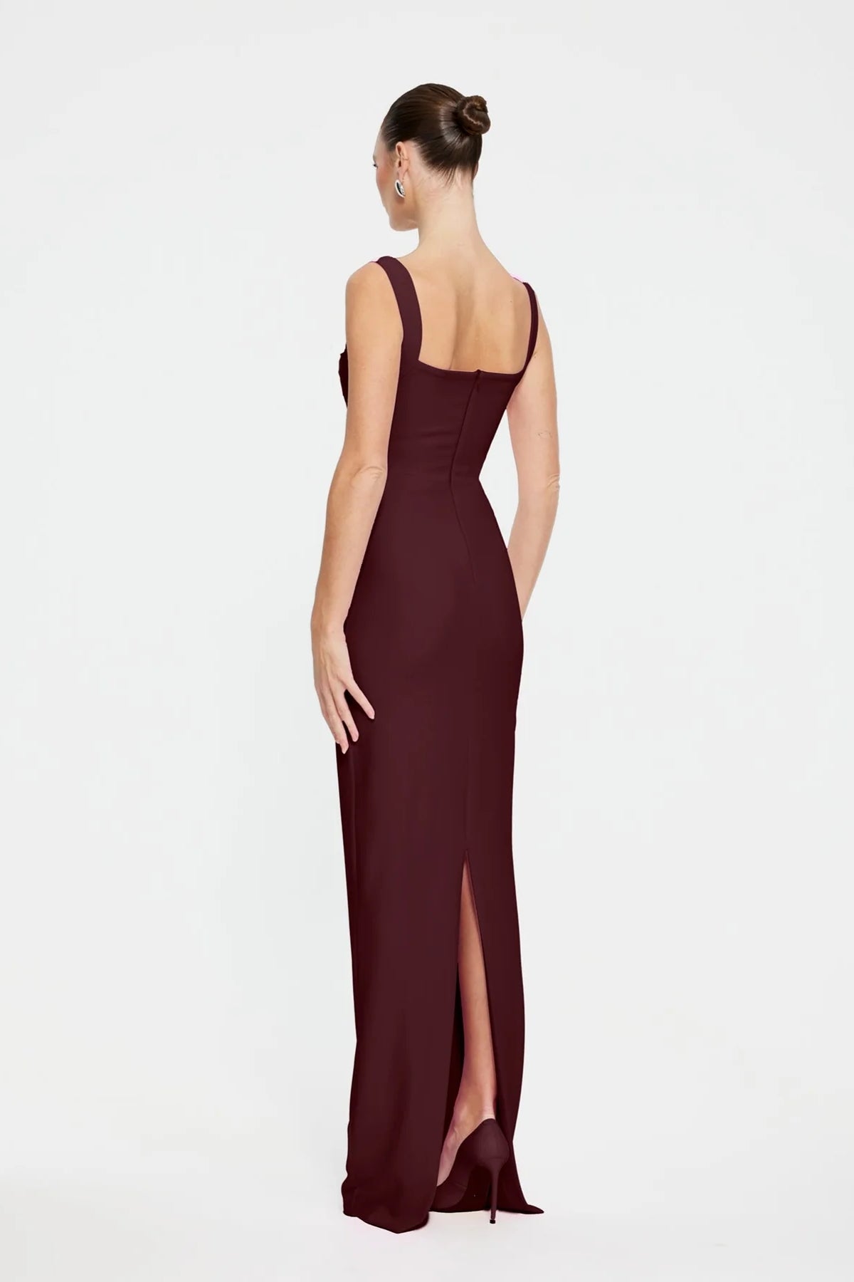 Marbella Gown in Wine by Effie Kats, a bustier-inspired floor-length gown with square neckline, ruched bodice, and figure-flattering stretch crepe.