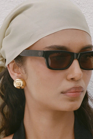Mare Earrings Gold by Heaven Mayhem – shell inspired gold earrings with rounded sculptural silhouette.