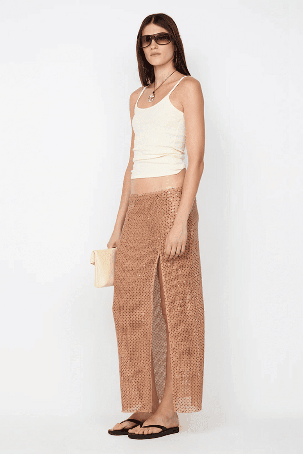 Margot Maxi Skirt Camel by BEC + BRIDGE — Shimmering sequin skirt with mid waist, straight fit, front split, and raw hem for a modern look.
