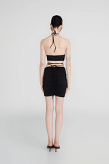 Margua Skirt Black by Maygel Coronel, ruched mini skirt with 3D floral detail. Perfect for beach styling or standout looks.